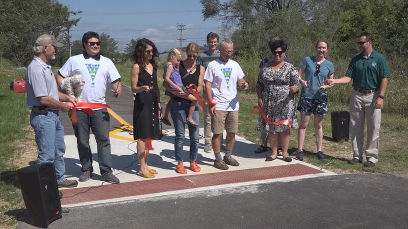 Community members and city leaders cut the ribbon to signify the opening of the Northend...