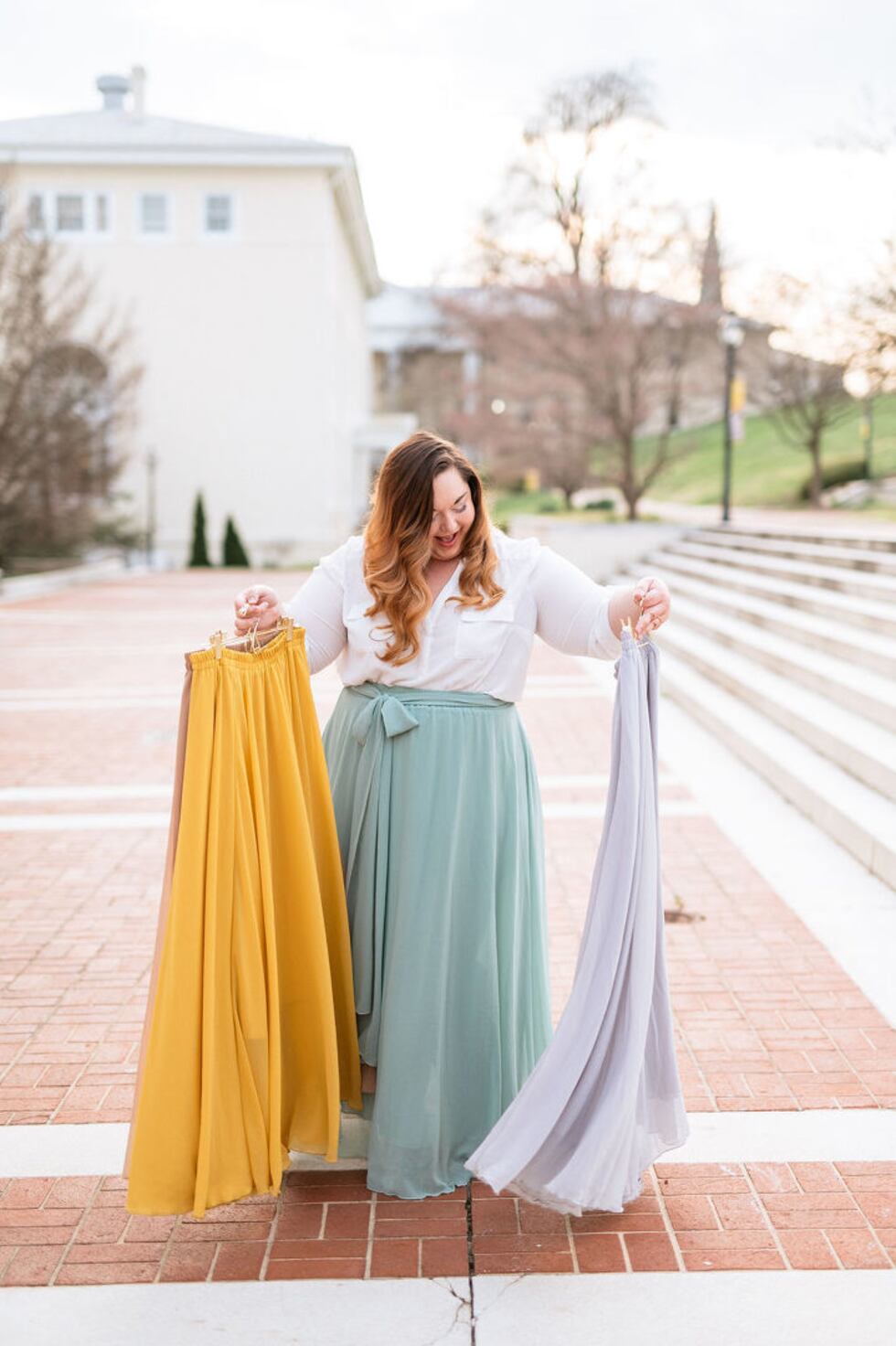 Amanda Shrader poses with skirts, all part of her "Skirt Project." (WHSV)