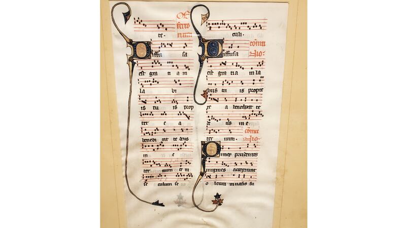 This photo provided by Will Sideri shows a 700-year-old manuscript that was used in the...