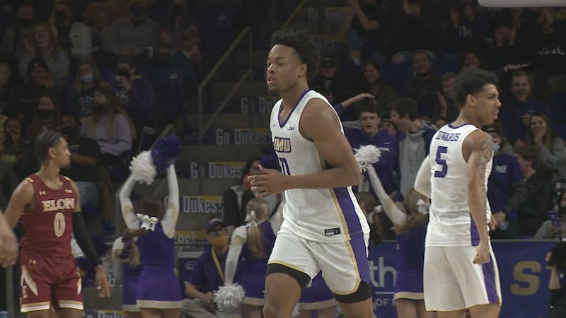 FILE - James Madison forward Justin Amadi sprints back on defense after scoring