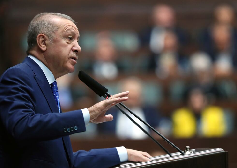 Turkish President Recep Tayyip Erdogan addresses his ruling party legislators, in Ankara,...