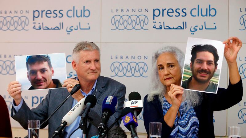 FILE - Marc and Debra Tice, the parents of Austin Tice, an American journalist who has been...
