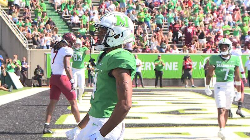 Marshall wide receiver DeMarcus Harris celebrates after catching a 12 yard touchdown pass