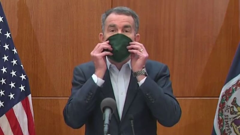 Governor Ralph Northam demonstrated how to use a mask on April 6 with his own, which was among...